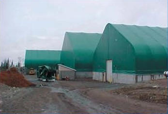 Four peak design fabric buildings were placed on a 4' thick by 5' high concrete foundation.